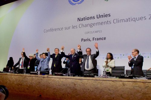 French Foreign Minister UN Secretary General Ban and French President Hollande Raise Their Hands After Representatives of 196 Countries Approved a Sweeping Environmental Agreement at COP21 in Paris Wikimedia Commons